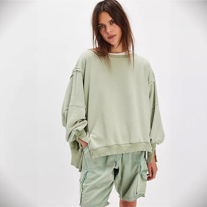 Damen oversized Sweatshirt mit Ballonärmeln, offenen Saumnähten und seitlichen Schlitzen – Avérine