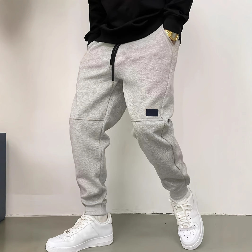 Herren Sportliche Jogginghose mit seitlichen Reißverschluss-Details Echoarchiv