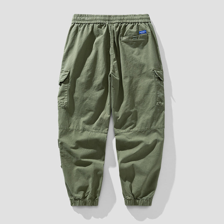 Herren Leichte Canvas-Cargohose im Joggerstil mit elastischem Bund, segmentierten Kniepaneelen und verdeckten Klappentaschen Echo Archiv