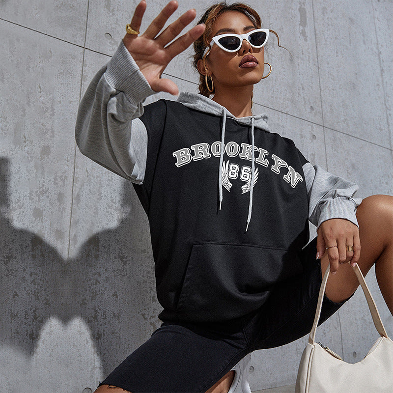 Damen Oversize-Kapuzenhoodie im Collegestyle mit Colorblock-Ärmeln, Kängurutasche und Kordelzug Echoarchiv