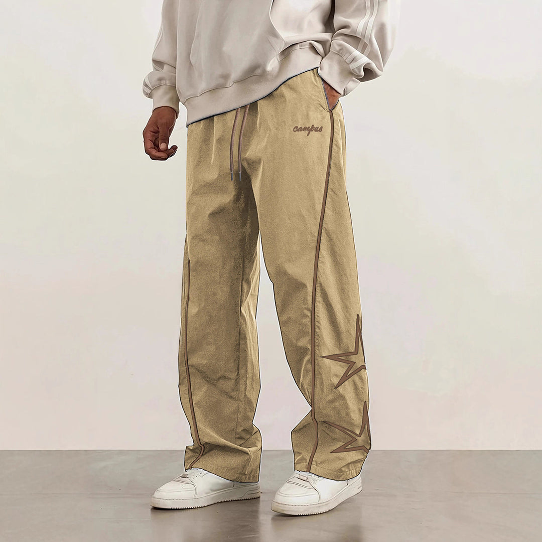 Herren Weite Trackpants mit Kontrastpaspel, Kordelzug und Sternapplikation Echo Archiv