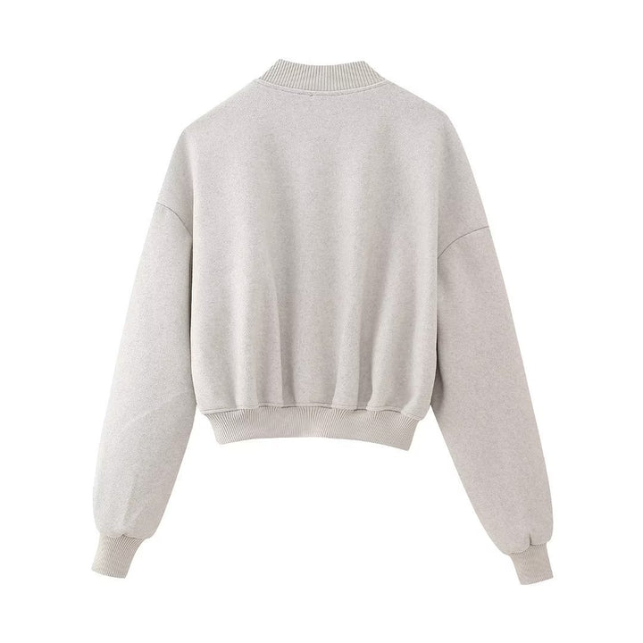 Damen kastiges Cropped Blouson aus Sweat mit Raglanärmeln, verdeckter Druckknopfleiste und breitem Rippbund – Avérine