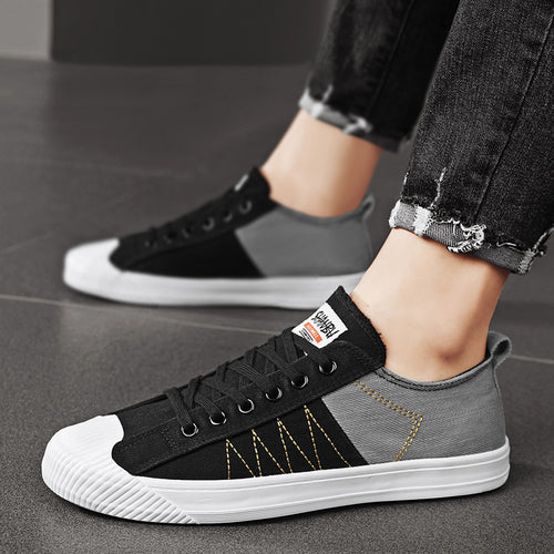 Unisex niedrige Canvas-Sneaker mit verstärkter Gummi-Zehenkappe und kontrastierenden Textilpaneelen – Norré