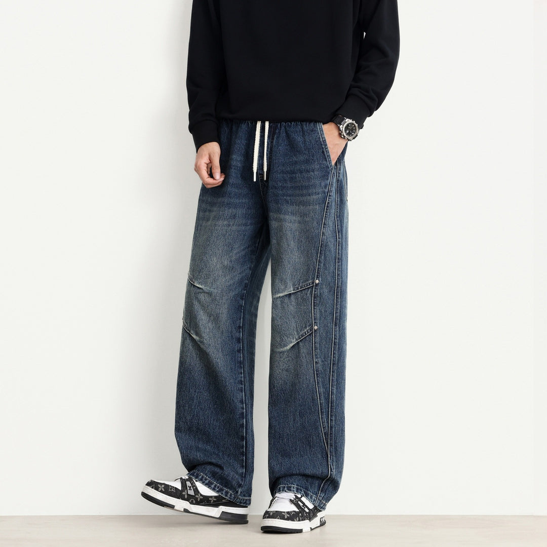 Herren Weite Denim-Hose mit Tunnelzugbund, Paneelnähten und Used-Waschung Echo Archiv