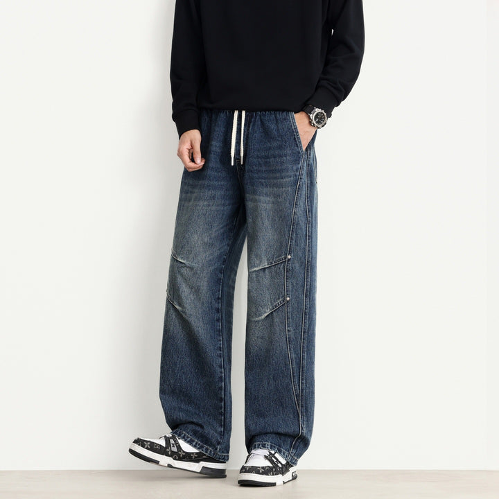 Herren Weite Denim-Hose mit Tunnelzugbund, Paneelnähten und Used-Waschung Echo Archiv