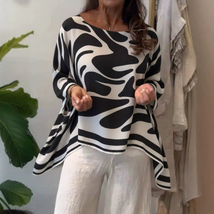 Damen Oversize Sommerbluse mit abstraktem Print, Fledermausärmeln und asymmetrischem Saum – Élovi