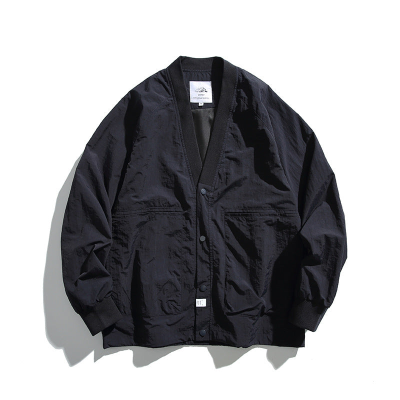 Unisex Weitgeschnittene Leichte Übergangsjacke mit V-Ausschnitt und Druckknopfleiste Echo Archiv