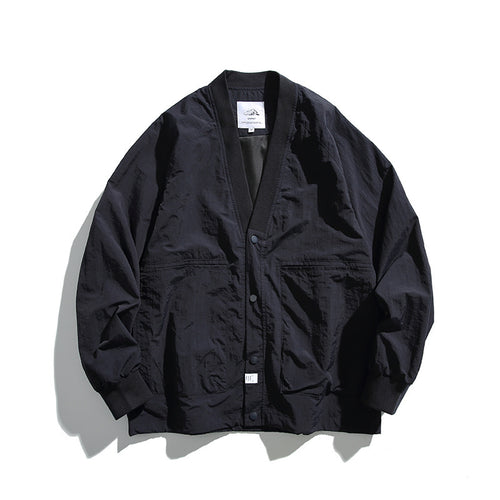 Unisex Weitgeschnittene Leichte Übergangsjacke mit V-Ausschnitt und Druckknopfleiste Echo Archiv