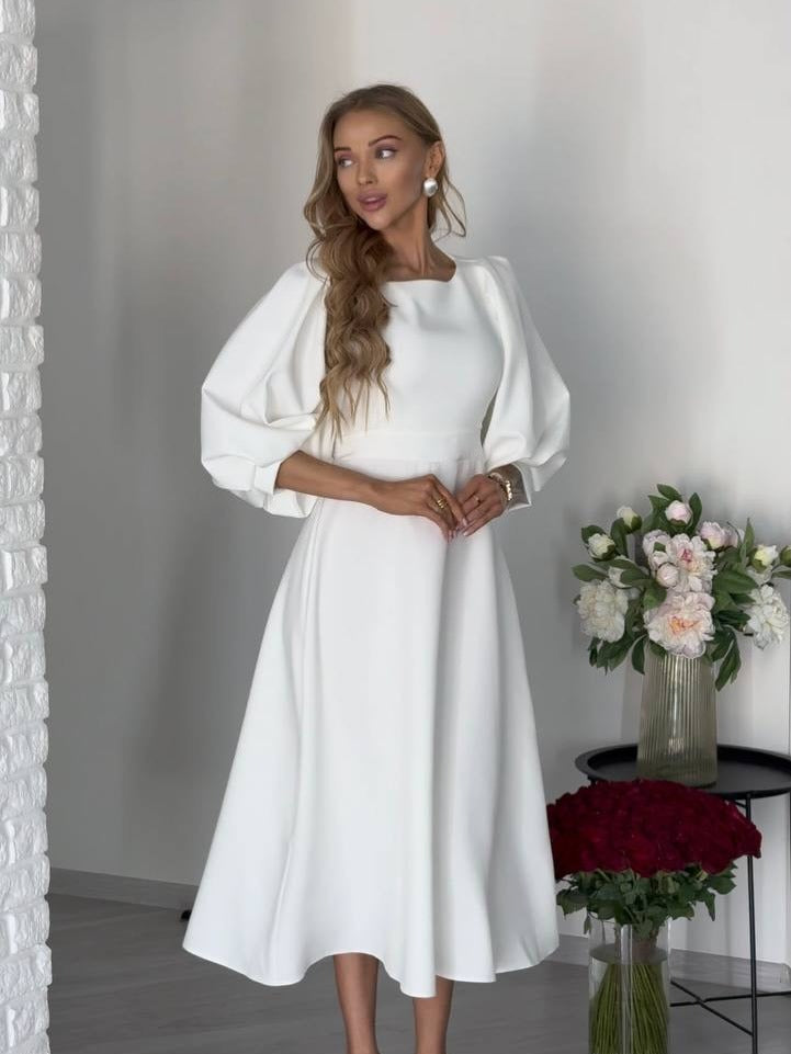Damen Midikleid mit offenem Rückenausschnitt, voluminösen Puffärmeln und Bindegürtel Echoarchiv