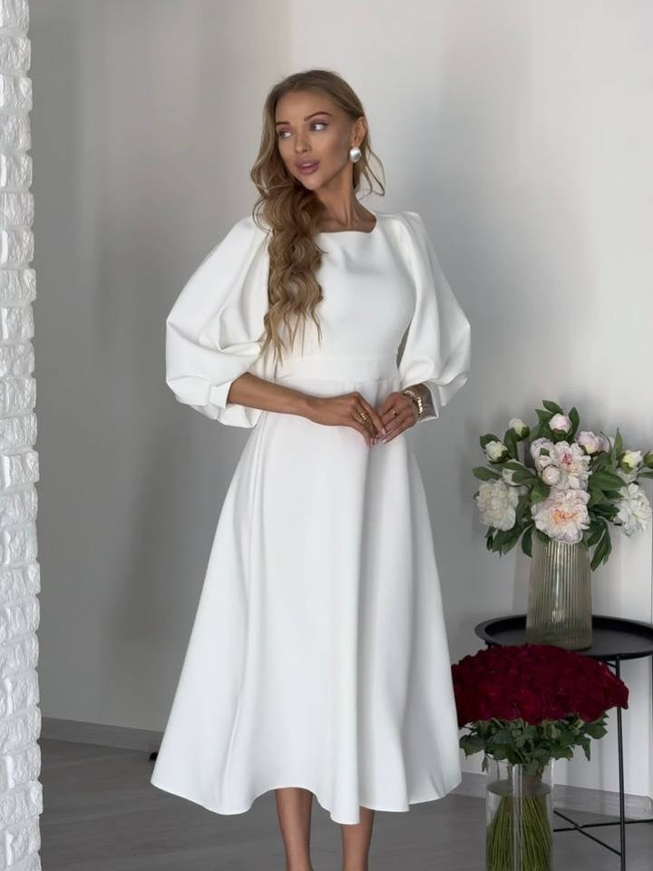 Damen Midikleid mit offenem Rückenausschnitt, voluminösen Puffärmeln und Bindegürtel Echoarchiv