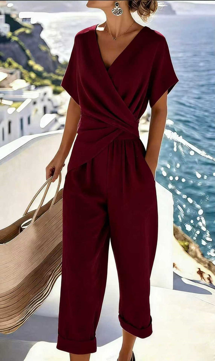 Damen Eleganter Jumpsuit mit Wickeloptik und breiten Beinen Echo Archiv