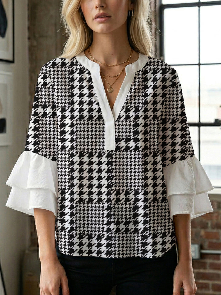 Damen Bluse mit voluminösen Rüschenärmeln und modernem Motiv Echo Archiv