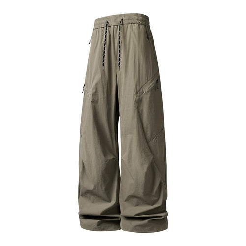 Herren Oversize-Utility-Cargo-Hose aus leichtem Nylon mit elastischem Kordbund, seitlichen Reißverschlusstaschen & weiter Ballon-Silhouette Echoarchiv