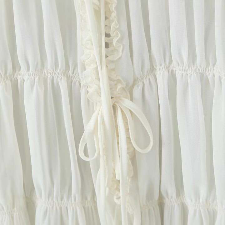 Damen Transparente Chiffonbluse mit Rüschenbindern, Stufenschnitt und Taillenraffung Echoarchiv