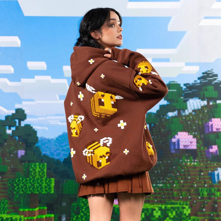 Unisex nan Kapuzenpullover mit eingestricktem Pixel-Bienenmotiv und aufgesetzter Kängurutasche Echoarchiv