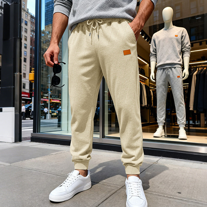 Herren Stepp-Jogginghose mit geometrischem Strukturmuster Echoarchiv