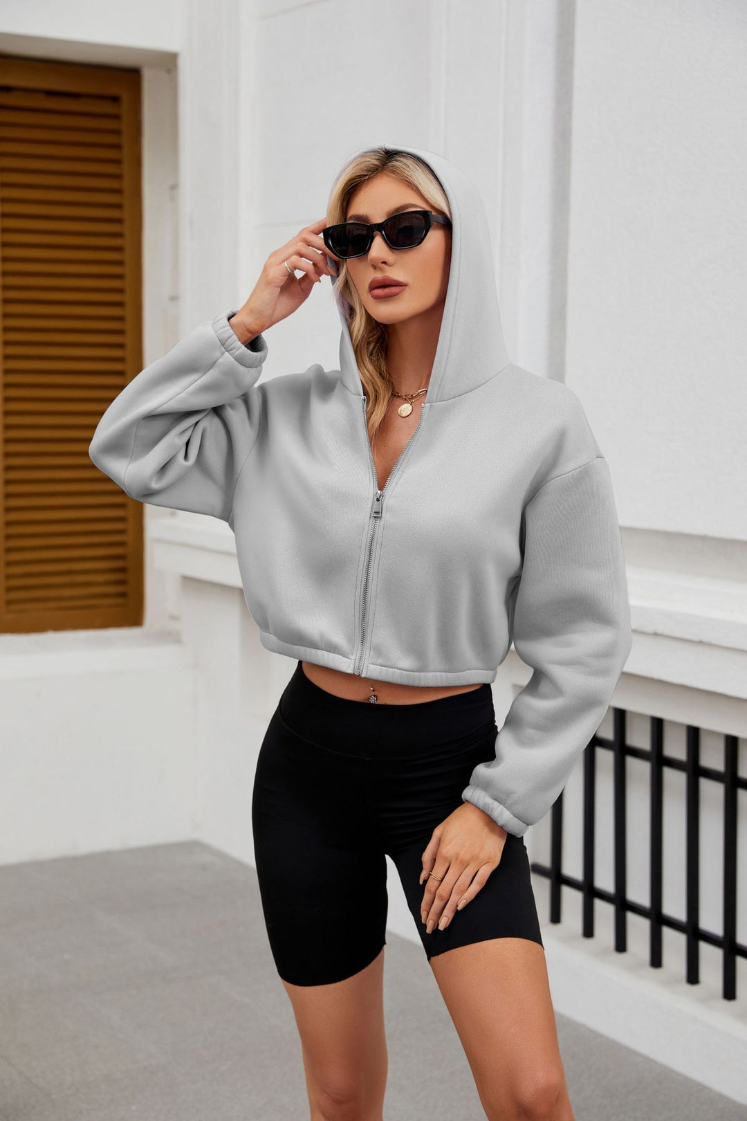 Damen Cropped Kapuzenjacke mit durchgehendem Reißverschluss und oversized Ärmeln Echo Archiv