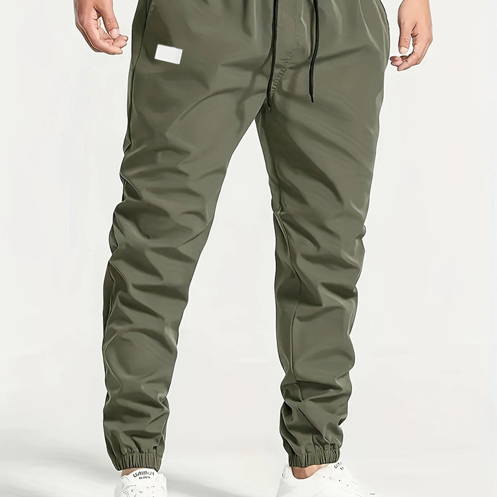 Herren Slim‑Tapered Tech‑Joggerhose mit Tunnelzugbund, elastischen Knöchelbündchen und funktionalen Seitentaschen Echo Archiv