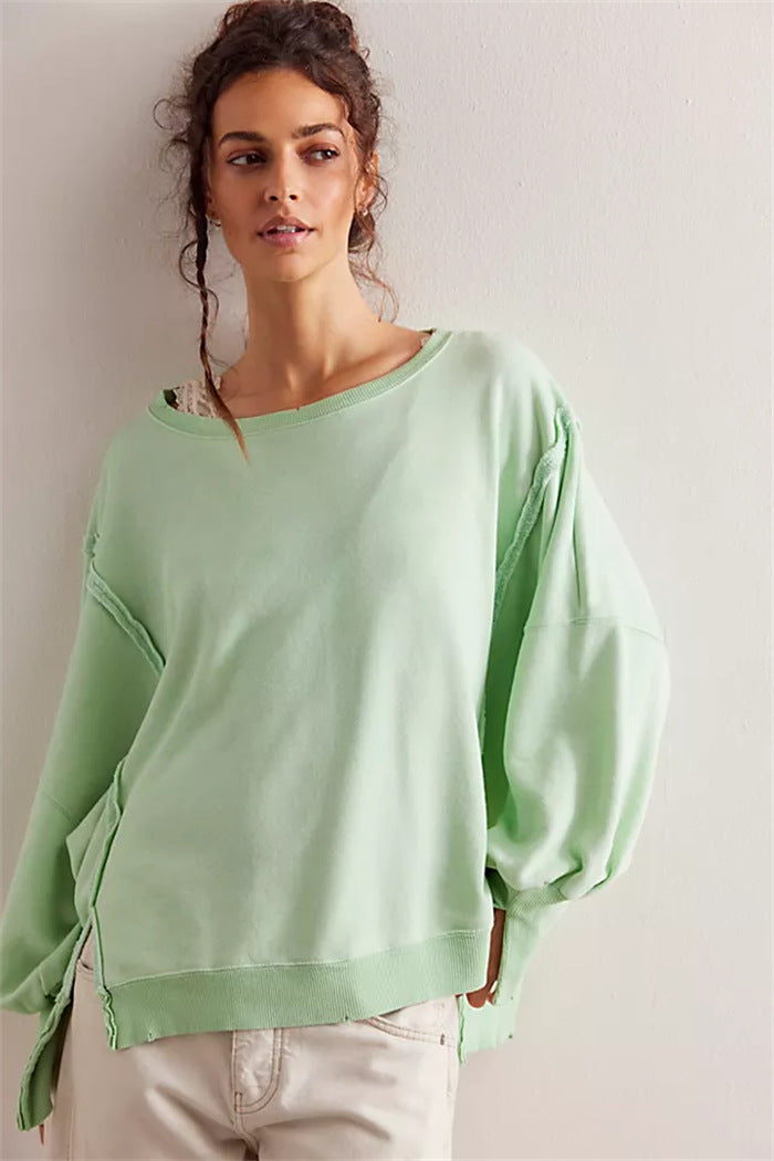 Damen oversized Sweatshirt mit Ballonärmeln, offenen Saumnähten und seitlichen Schlitzen – Avérine