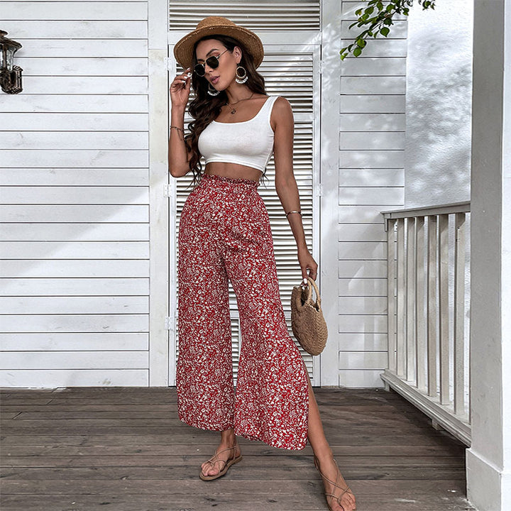 Damen Weite hochgeschnittene Palazzo‑Hose mit floralem Muster und seitlichem Beinschlitz Echoarchiv