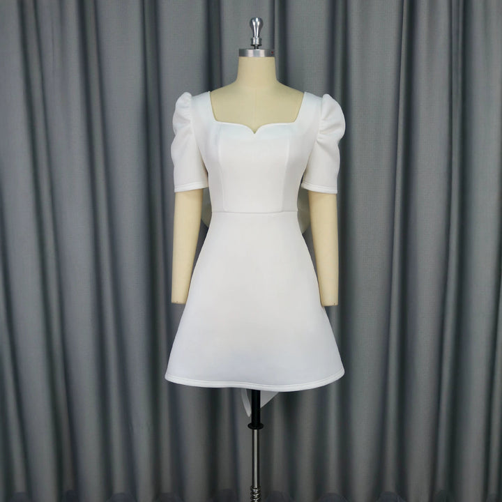 Damen Kleid mit voluminösen Puffärmeln und dekorativem Schleifendesign Echo Archiv