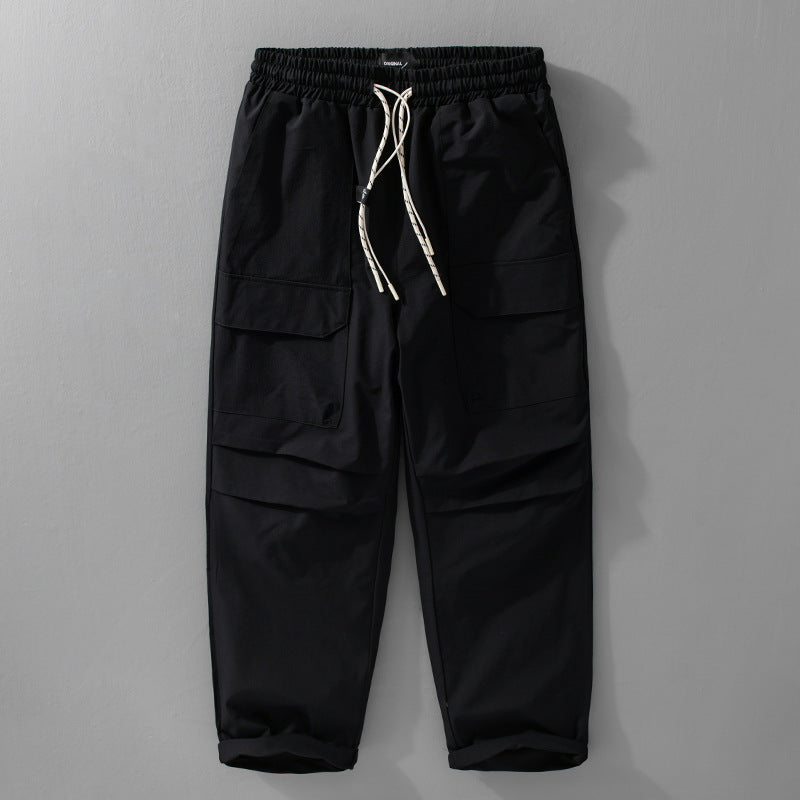 Herren Oversize-Cargohose aus leichtem Funktionsstoff mit Kordelzugbund und Mehrfachtaschen Echoarchiv