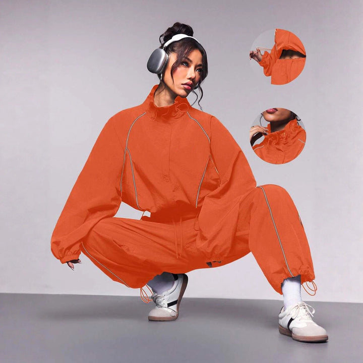 Damen sportives Cropped Windbreaker-Set mit Stehkragen Tunnelzug und reflektierenden Paspeln – Avérine