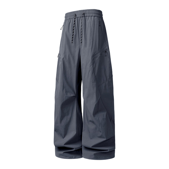 Herren Oversize-Utility-Cargo-Hose aus leichtem Nylon mit elastischem Kordbund, seitlichen Reißverschlusstaschen & weiter Ballon-Silhouette Echoarchiv