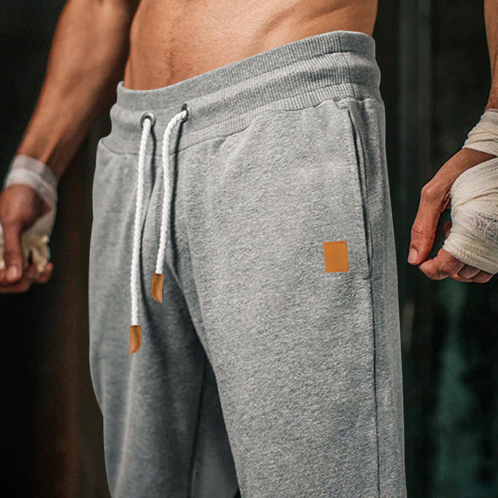 Herren bequeme Jogginghose mit elastischem Bund und modischen Details Echoarchiv