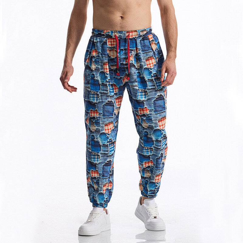 Herren Gemusterte Jogginghose im tapered Schnitt mit elastischem Bund und Tunnelzug Echo Archiv