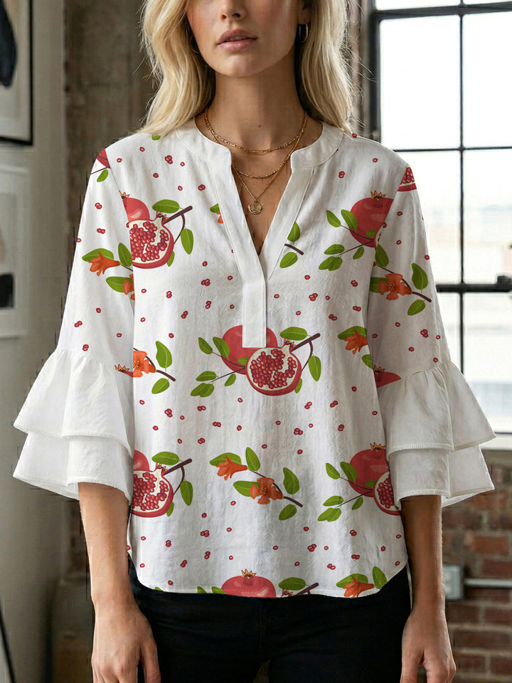Damen Bluse mit voluminösen Rüschenärmeln und modernem Motiv Echo Archiv