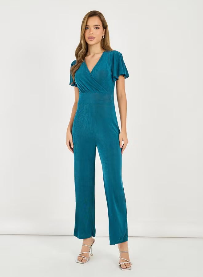 Damen eleganter Jumpsuit mit fließendem Schnitt und detailreichen Puffärmeln Echo Archiv