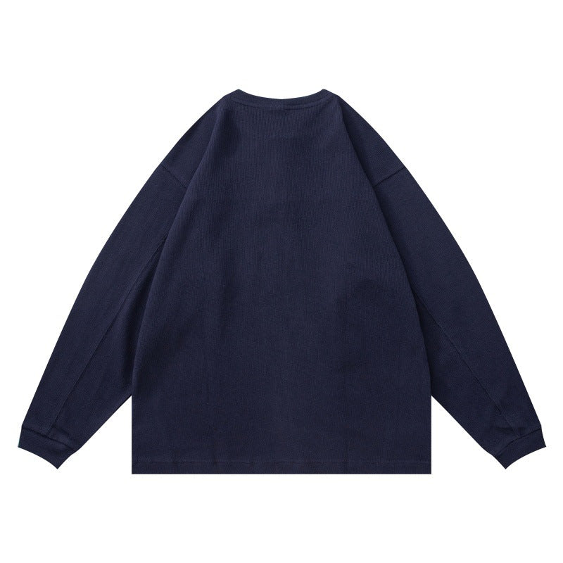 Unisex Strukturiertes Henley-Longsleeve mit Waffelstruktur, halber Knopfleiste und überschnittener Schulter Echoarchiv