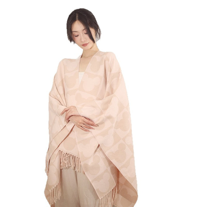 Damen Oversize-Jacquardponcho mit grafischem Kopf-Silhouettenmuster und Fransen – Avérine