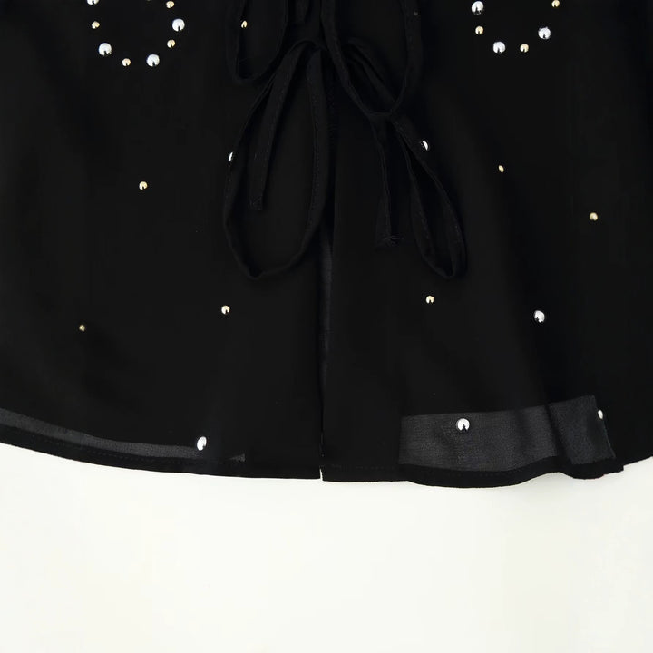 Damen Chiffon-Bluse mit Paillettenbesatz, tiefem V‑Ausschnitt und dekorativen Bindebändern Echoarchiv