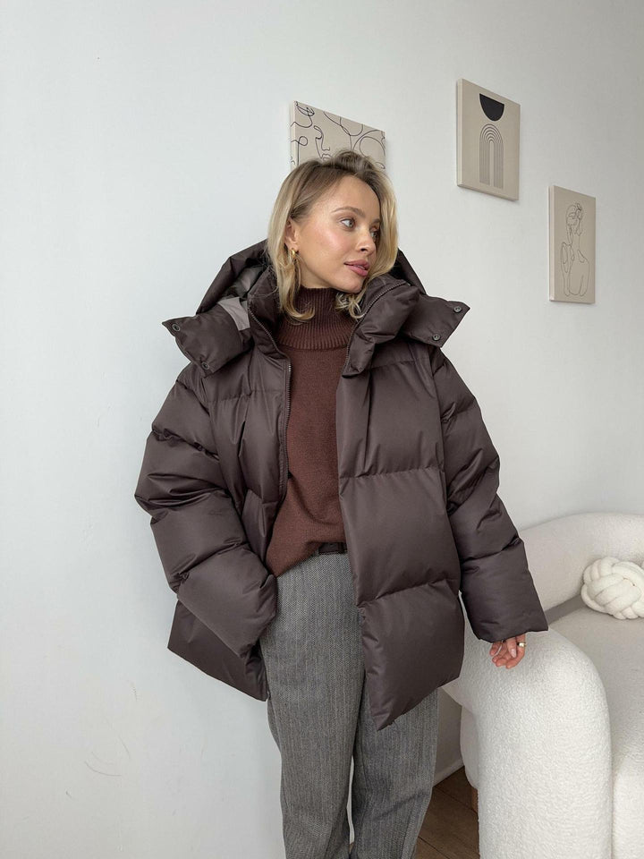 Damen Oversize Steppjacke mit Kapuze und wattierter Thermofüllung Echoarchiv