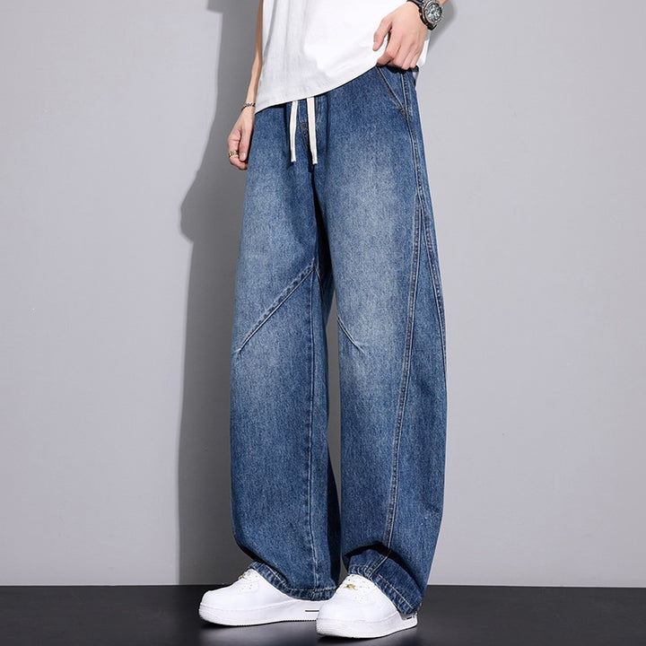 Herren Weite Baggy-Jeanshose mit Tunnelzugbund, markanten Teilungsnähten & elastischem Saum Echoarchiv