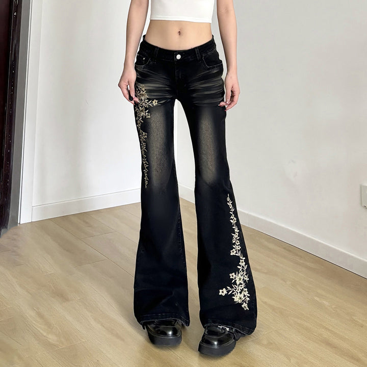 Damen hochtaillierte Schlagjeans mit floraler Stickerei und verwaschenem Look Echo Archiv