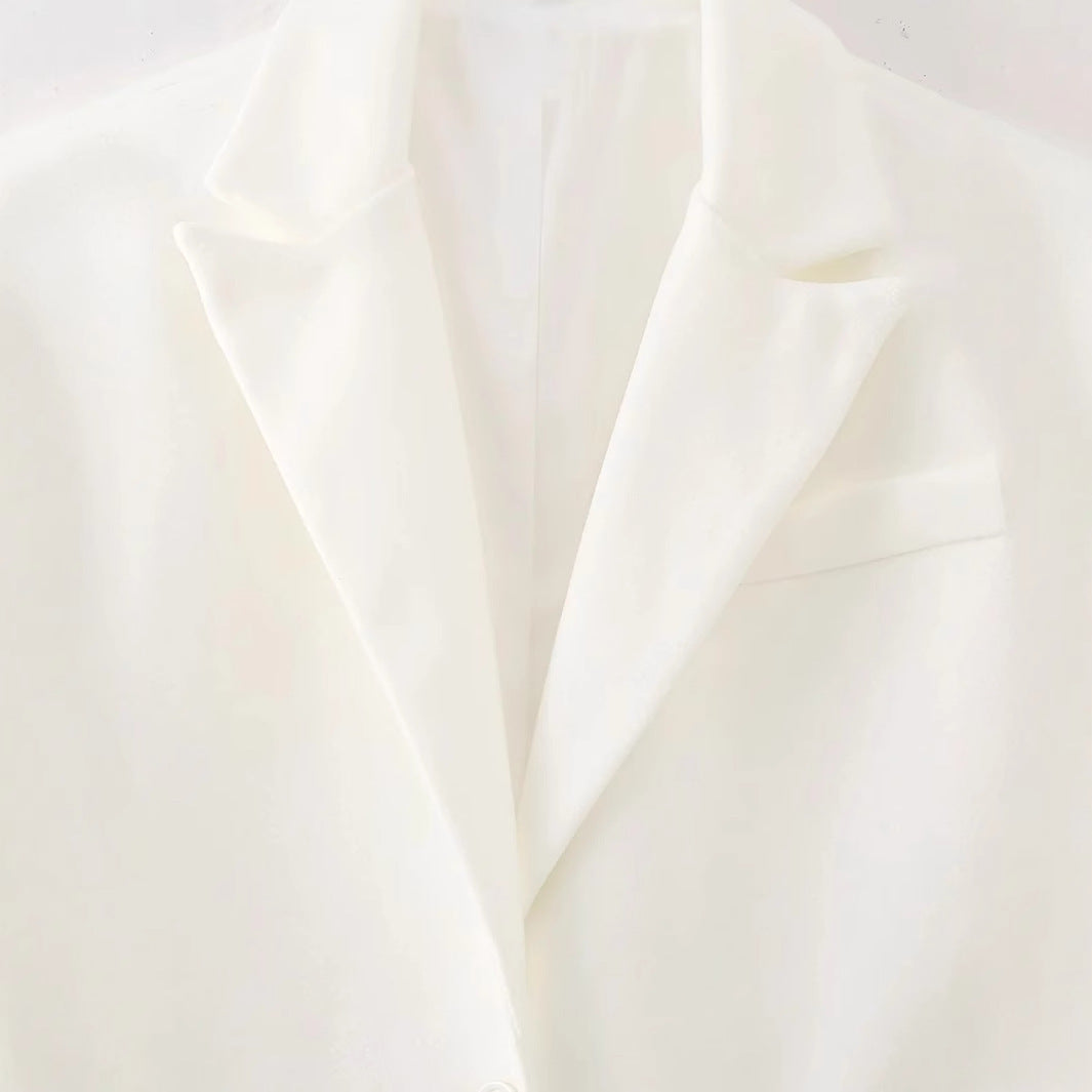 Damen langer Fransen‑Mantelblazer mit Plissee‑Saum, Reverskragen und Pattentaschen – Célinea