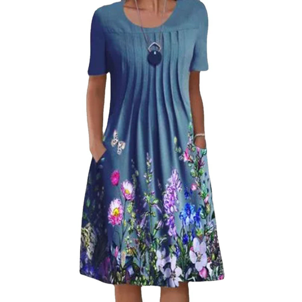 Damen Plissee Midi Kleid mit kurzen Ärmeln, seitlichen Taschen und floralem Saum – Élara