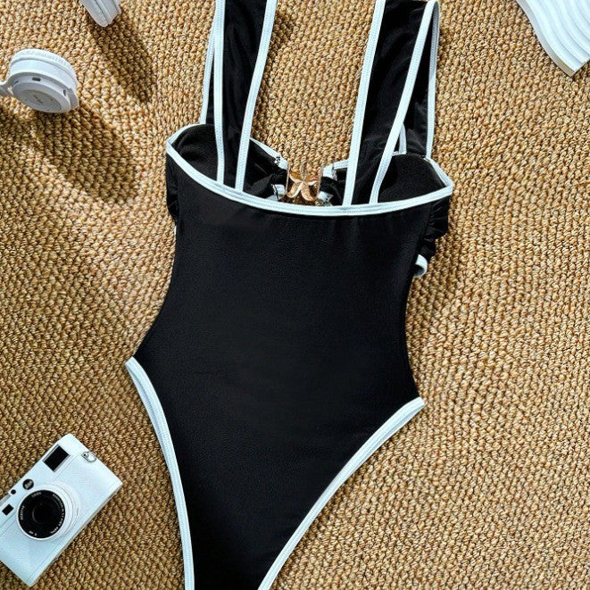 Damen Eleganter Einteiler mit raffiniertem Cut-Out und goldenen Akzenten Echo Archiv