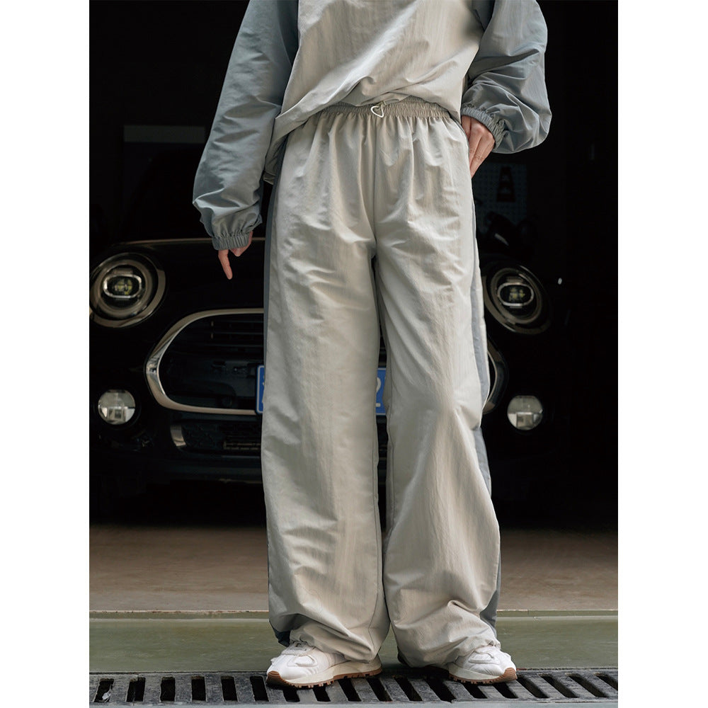 Damen Weite High‑Waist Trackhose im Palazzoschnitt mit kontrastierendem Seitenstreifen Echoarchiv
