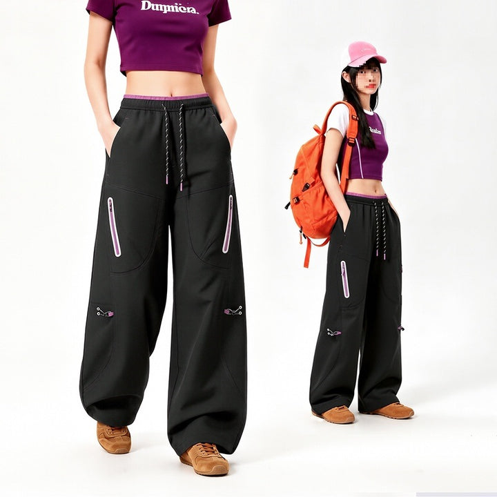 Damen Oversize Tech-Loungehose mit Kontrastnähten, reflektierenden Reißverschlusstaschen & Kordelbund Echoarchiv