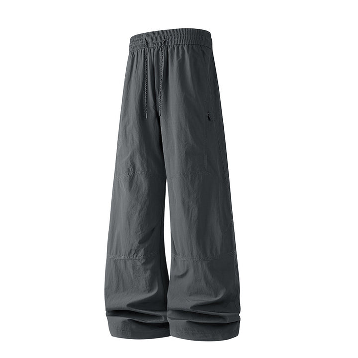 Herren Weite Baggy‑Hose mit Tunnelzugbund und Paneel‑Konstruktion Echo Archiv