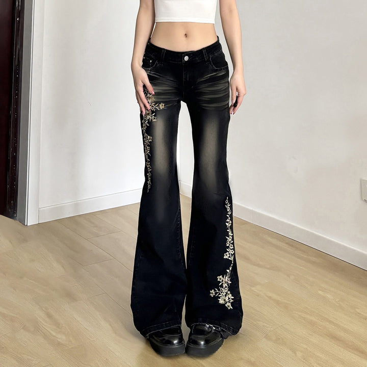 Damen hochtaillierte Schlagjeans mit floraler Stickerei und verwaschenem Look Echo Archiv