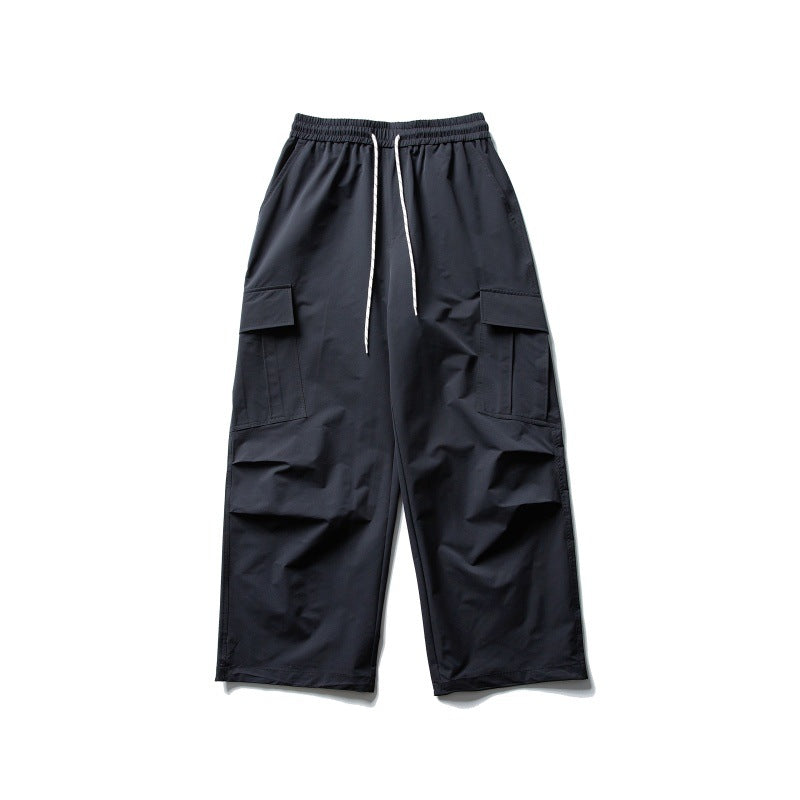 Unisex Weite Cargo-Utility-Hose im Baggy-Schnitt mit elastischem Kordelbund und großzügigen Klappentaschen Echoarchiv