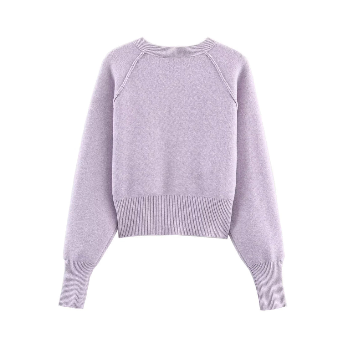 Damen kurze Knopfstrickjacke mit Raglanärmeln, breitem Rippbund und verlängerten Ärmelbündchen – Célinea