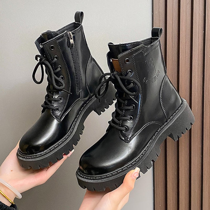 Damen nan knöchelhohe Combat-Boots in Lackoptik mit robuster Profilsohle und seitlichem Reißverschluss Echo Archiv