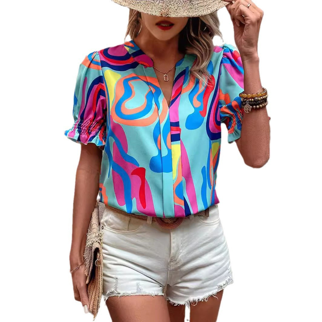 Damen Bluse mit kessen Puffärmeln und kreativem Grafikdesign Echo Archiv