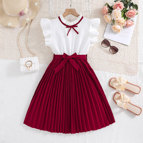 Mädchen Faltenrockkleid mit Puffärmeln und Taillenknoten Echoarchiv